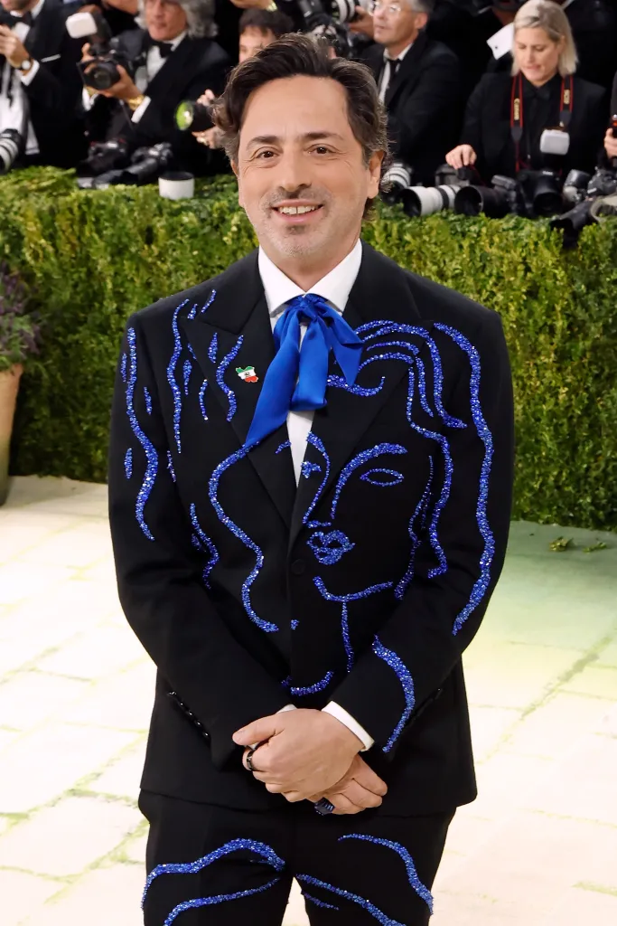 Sergey Brin wearing a black suit with blue crystal detailing at the Met Gala.