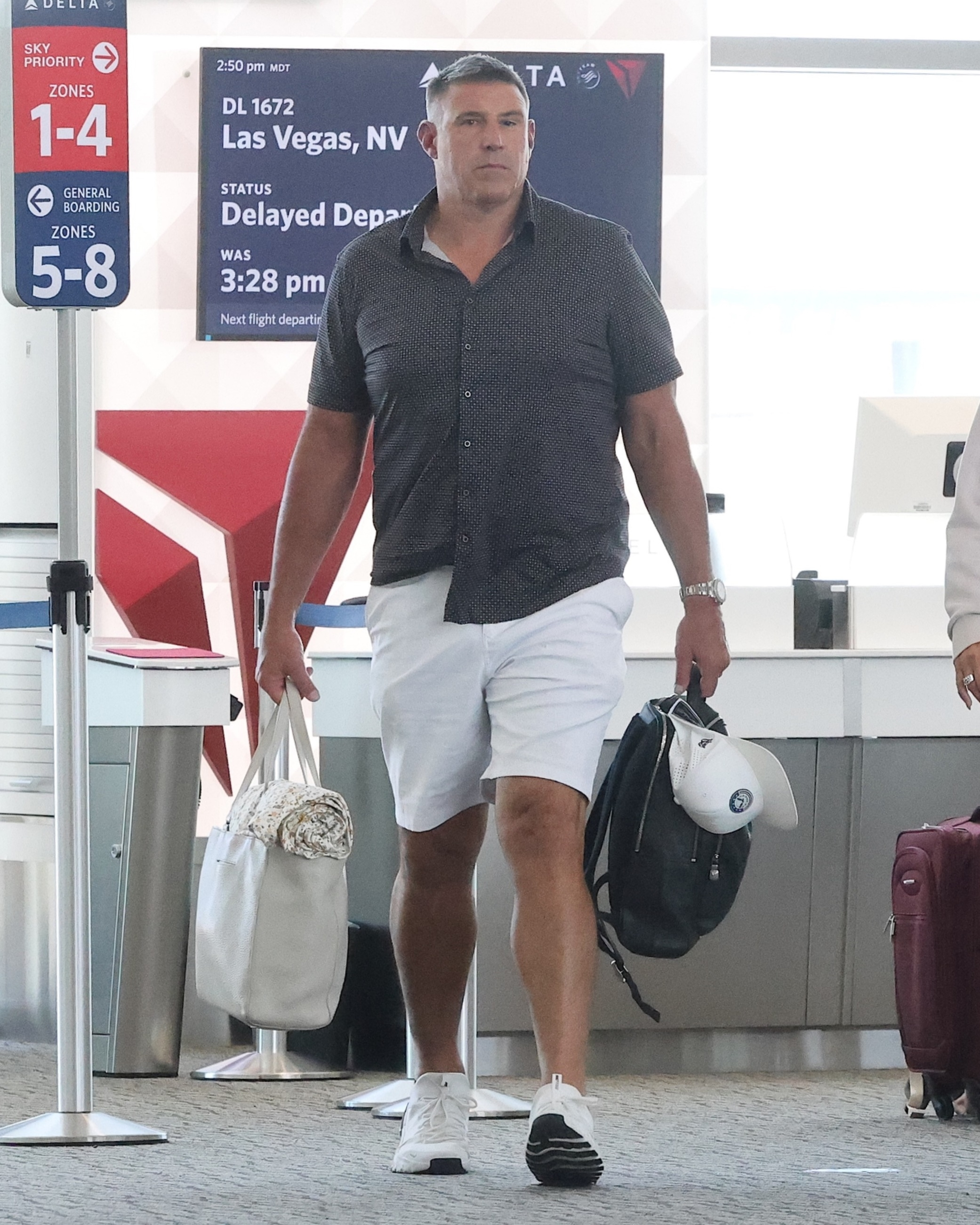 Mike Vrabel walking through Salt Lake City Airport.