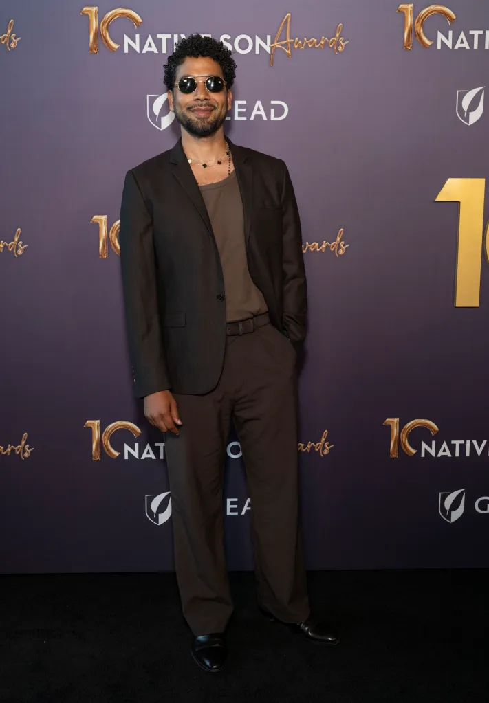 Jussie Smollett in a brown suit and sunglasses at the Native Son Awards.