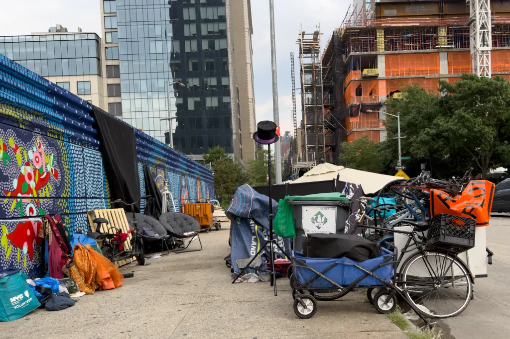 Homeless encampment near the Intrepid Museum on Manhattan’s West Side, with construction visible in the background.