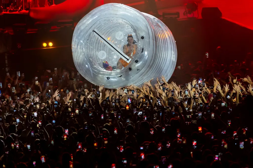 Katy Perry performing in a hamster ball above the audience at the Paleo Festival.