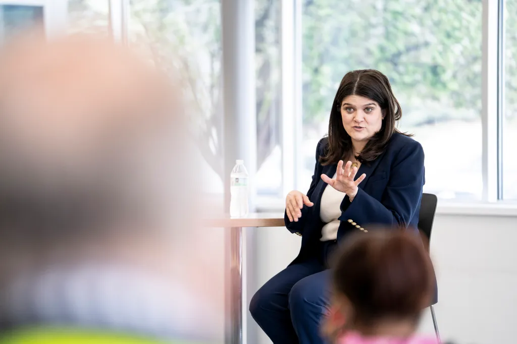 U.S. Rep. Haley Stevens speaking at a town hall meeting.