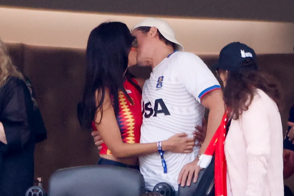 Ines de Ramon and Brad Pitt kissing during the FIFA World Cup 2026 Quarter Final football match between Spain and Belgium.