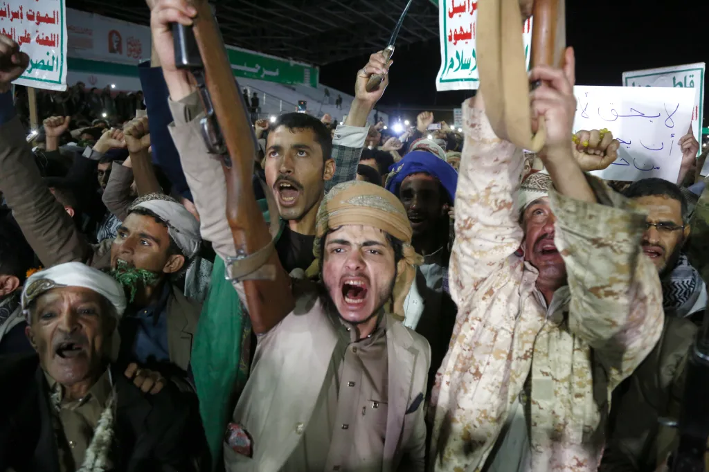 Yemeni protesters shout slogans and brandish weapons while celebrating a maritime blockade against Saudi Arabia.