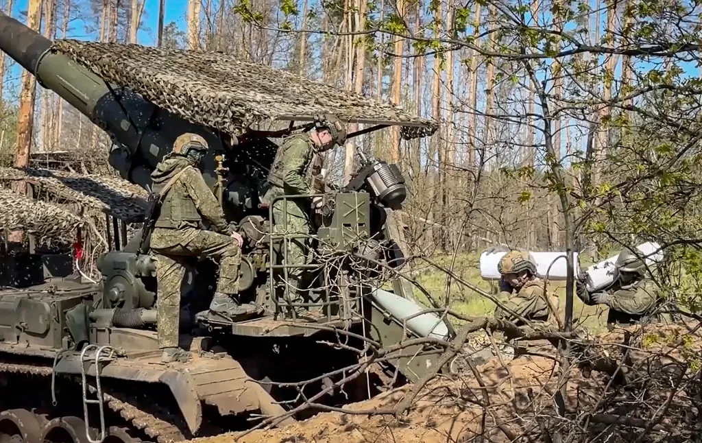 Russian servicemen preparing to fire a self-propelled gun 'Pion' in Ukraine.