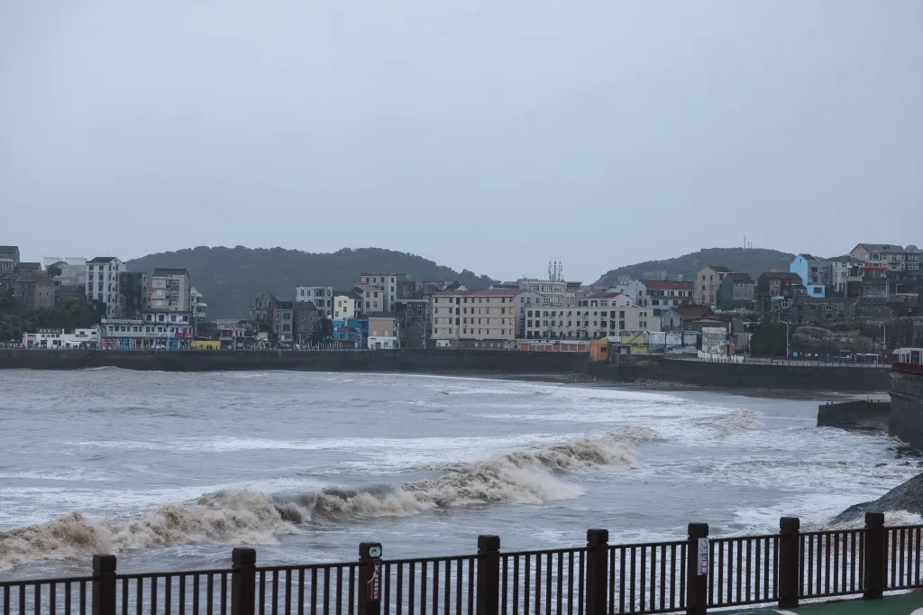 Waves crash onto the beach in Shitang Town, Wenling, China, on July 11, 2026