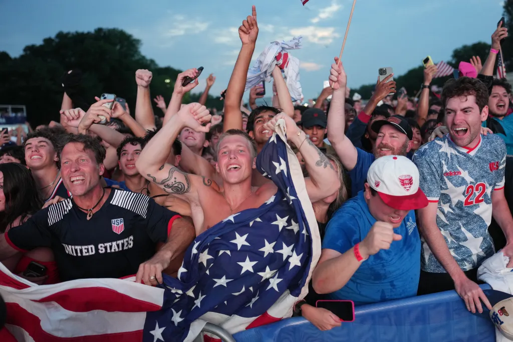 US fans celebrate a goal while watching the FIFA World Cup 2026 Round of 16 match between the United States and Belgium on a big screen at the National Mall in Washington, D.C.