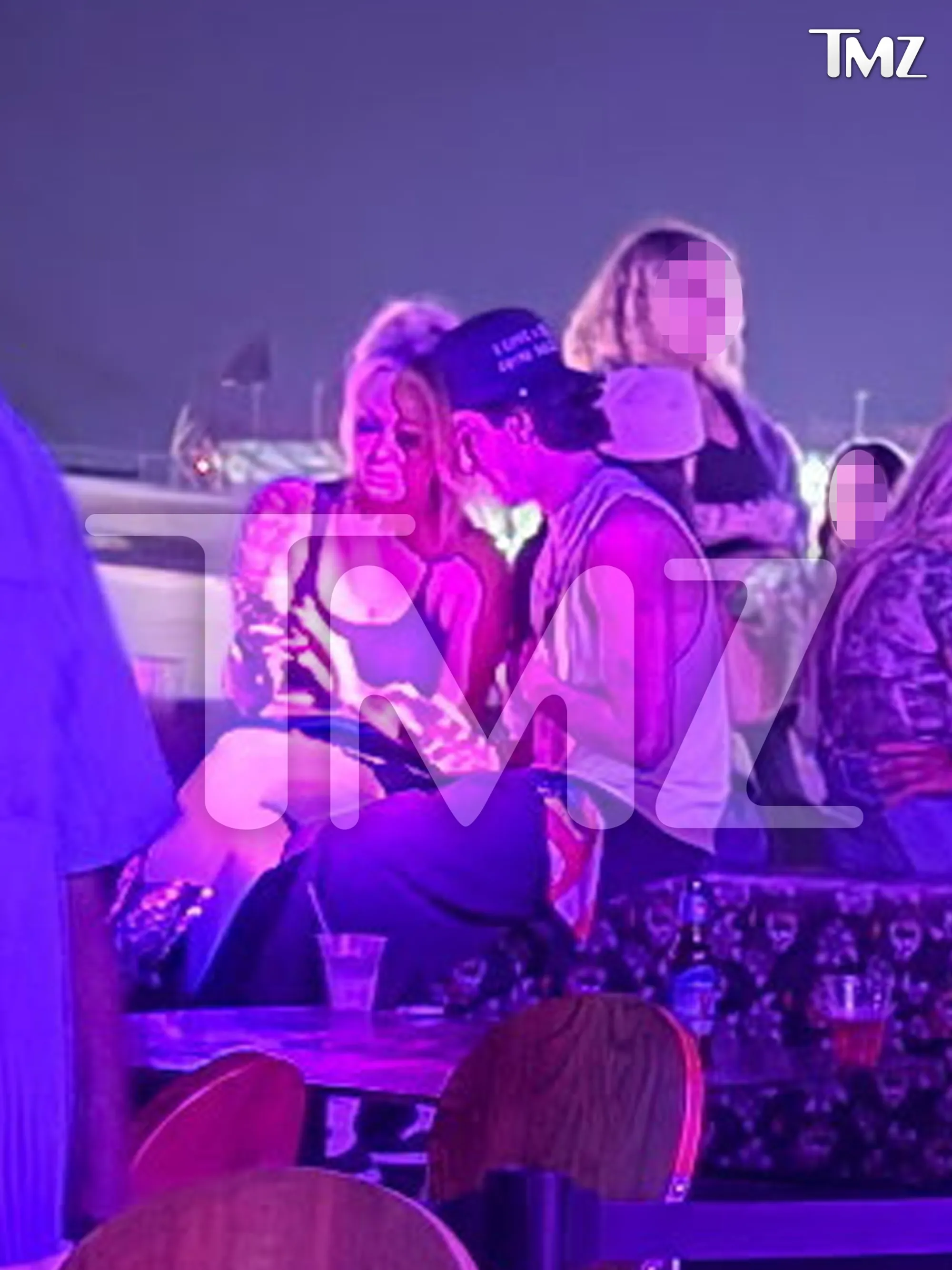 Bunnie Xo and Dylan Wolf in a bar.