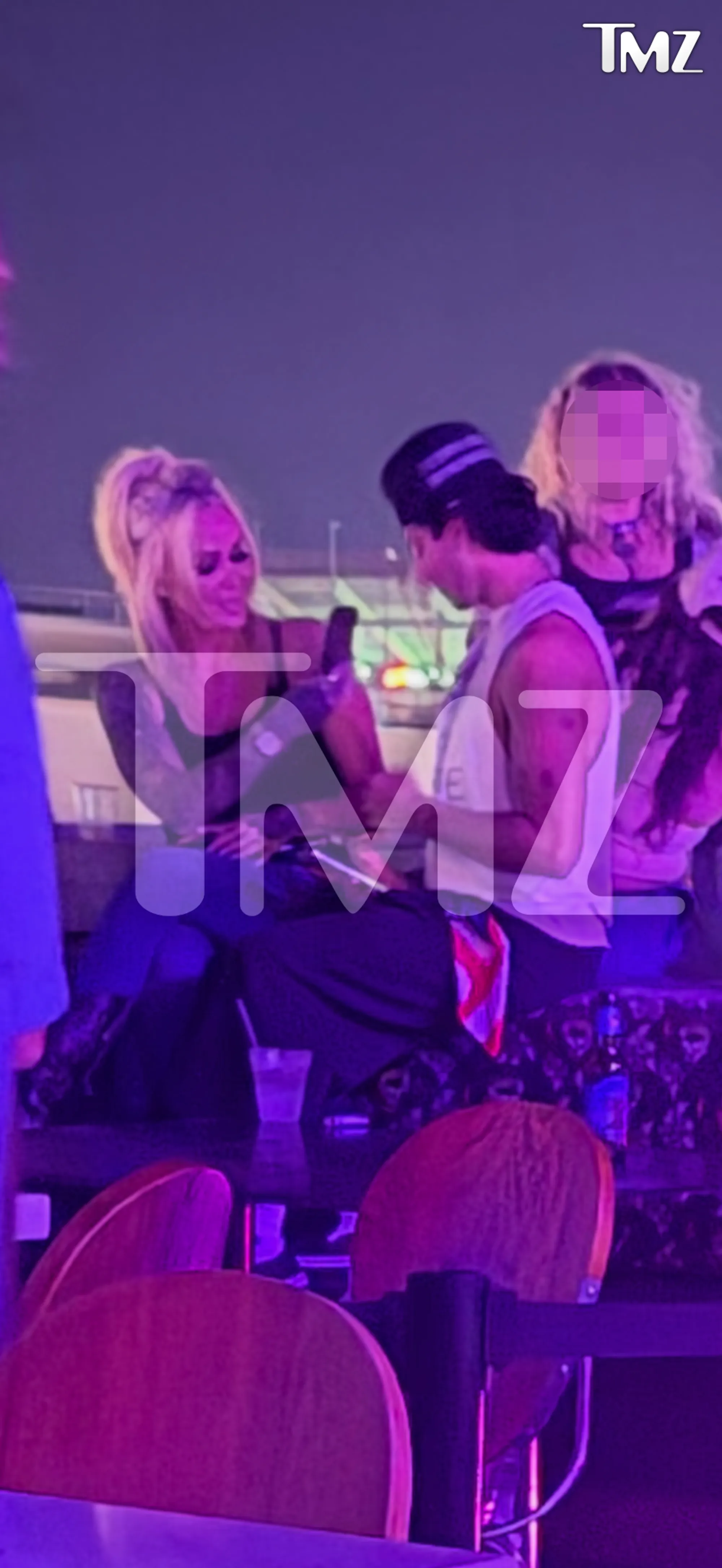 Bunnie Xo and Dylan Wolf hanging out at a bar.