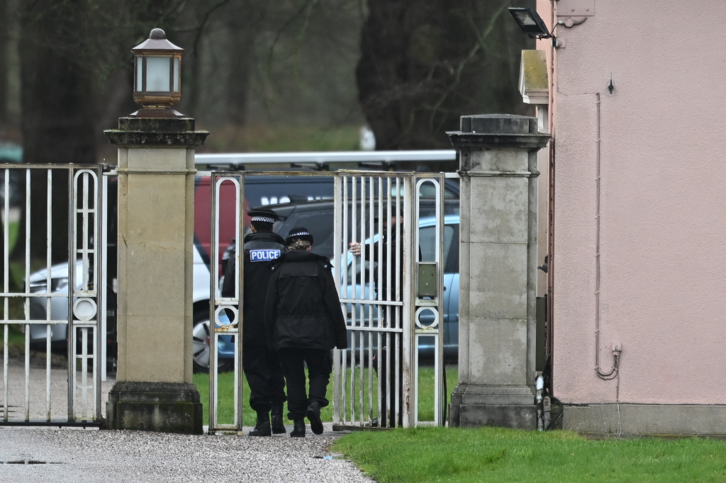 Police officers at the gates of the Royal Lodge.