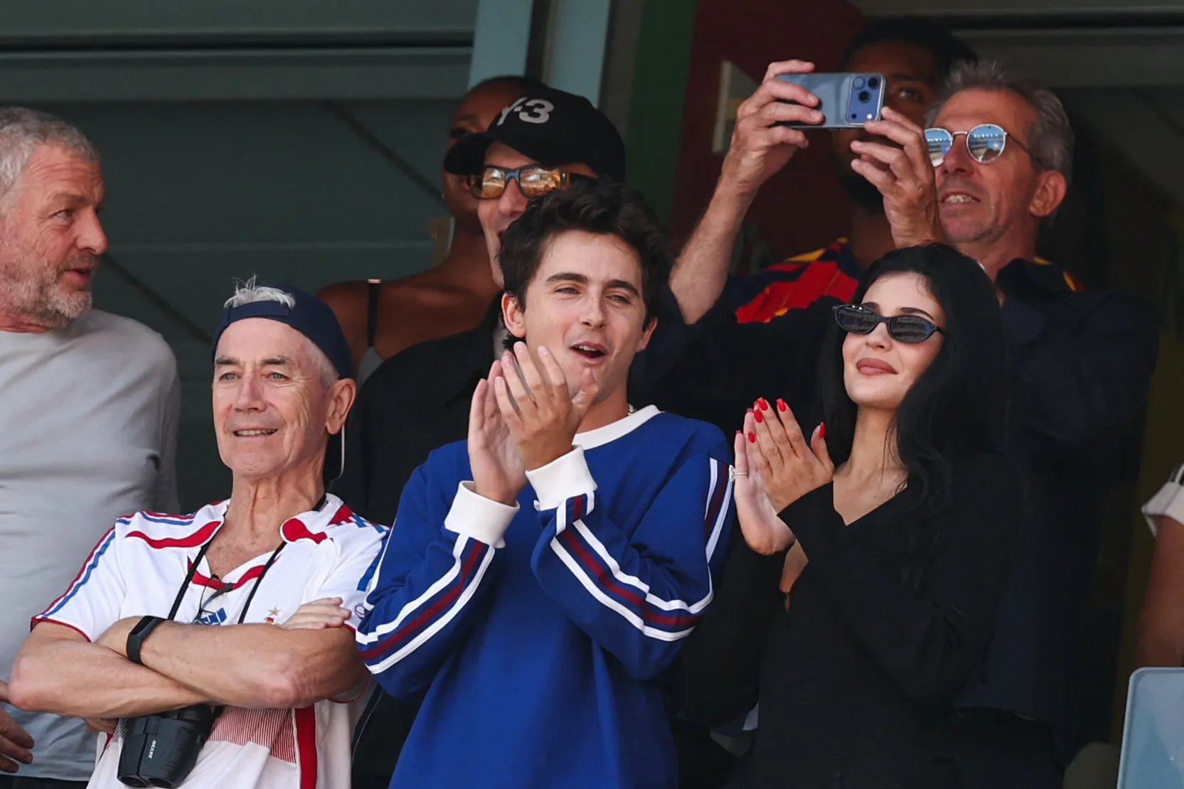 Timothee Chalamet, Kylie Jenner, and Marc Chalamet applaud at the 2026 World Cup final.