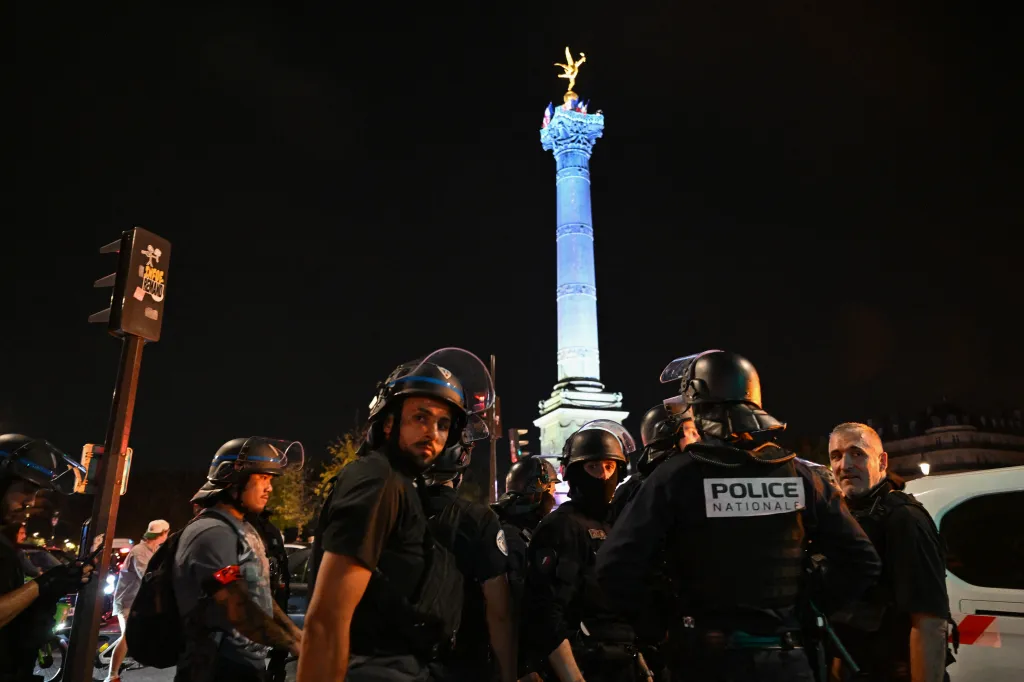 French police officers at night near the Place de la Bastille in Paris.
