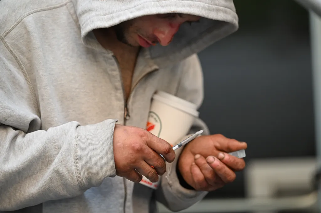 Person with needle on 44th and 8th ave. in Mid-Town, NY.