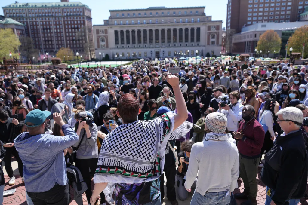 Aidan Parisi (center, back to camera, wearing a keffiyeh) rallying at Columbia University.