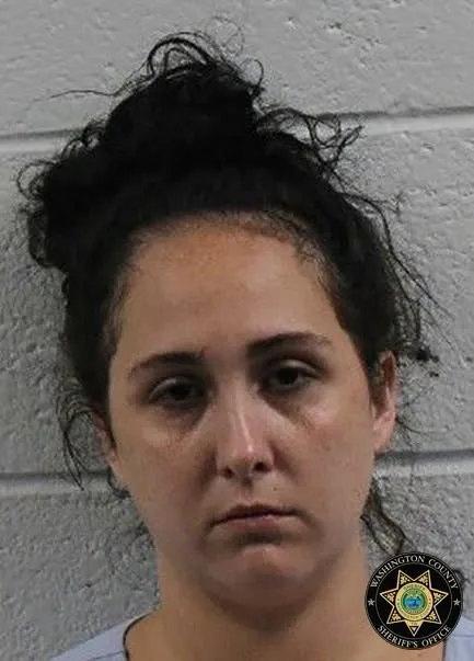 Mugshot of Mikaylee Rae Beirne with dark hair pulled back, looking directly at the camera with a neutral expression.
