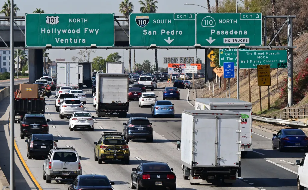Traffic jam on a Los Angeles freeway with cars and trucks heading north.