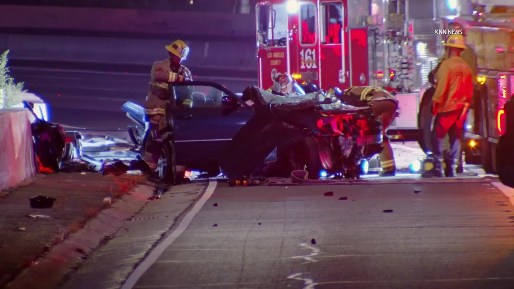 Firefighters at the scene of a fiery multiple-vehicle crash on the 405 Freeway.