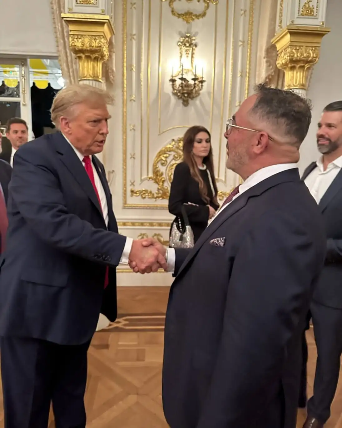 Aaron Lewis shakes hands with President Donald Trump in 2025.