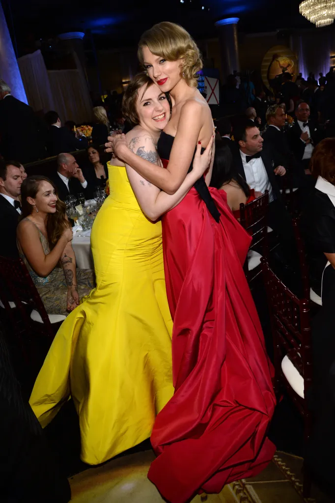 Lena Dunham embracing Taylor Swift at the 71st Annual Golden Globe Awards.