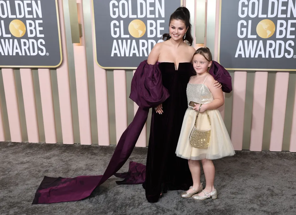 Selena Gomez and Gracie Elliott Teefey pose on the red carpet at the 80th Golden Globe Awards.
