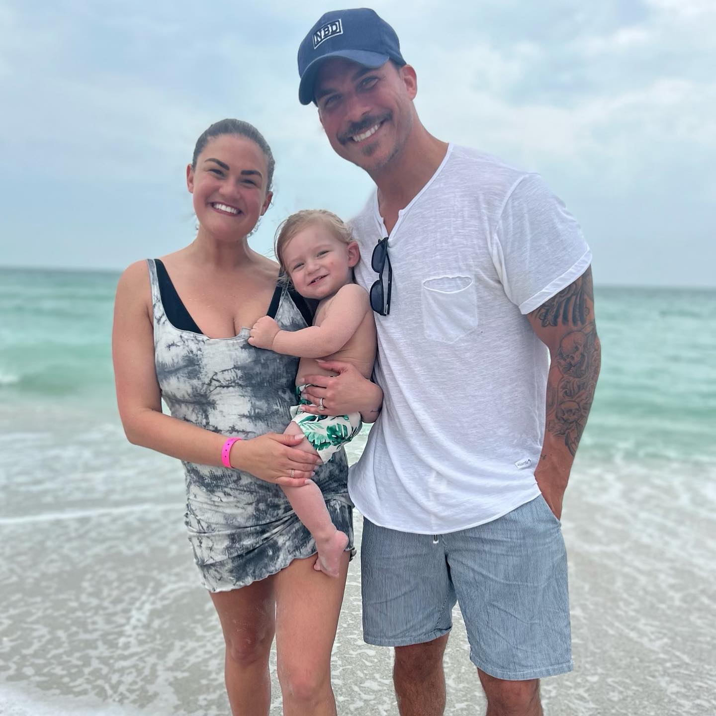 Jax Taylor, Brittany Cartwright, and their son Cruz at the beach.