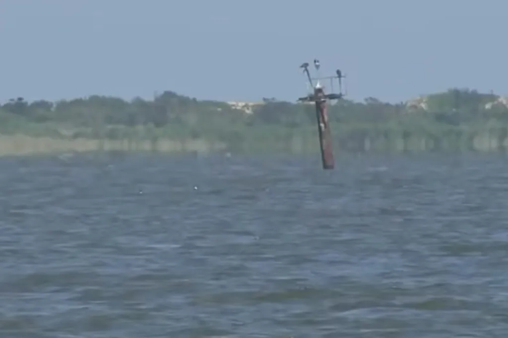 The channel marker struck by the boat.