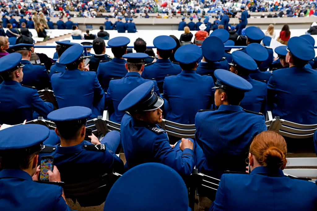 U.S. Air Force Academy cadets watch a graduation ceremony.