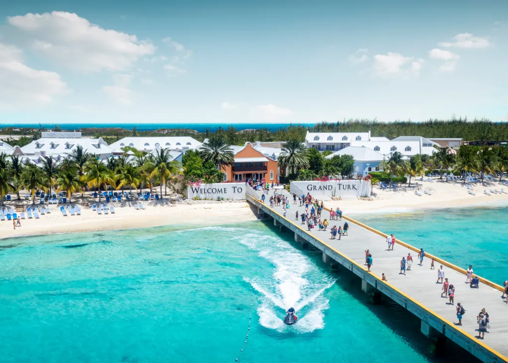Tourists on a board walk after arriving on Grand Turk Island.