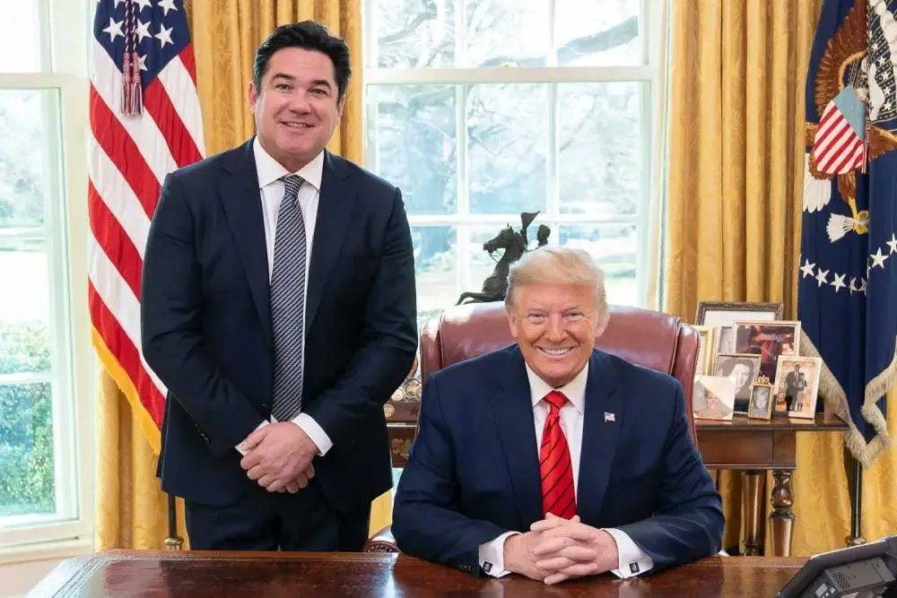 Dean Cain and Donald Trump smiling in the Oval Office.