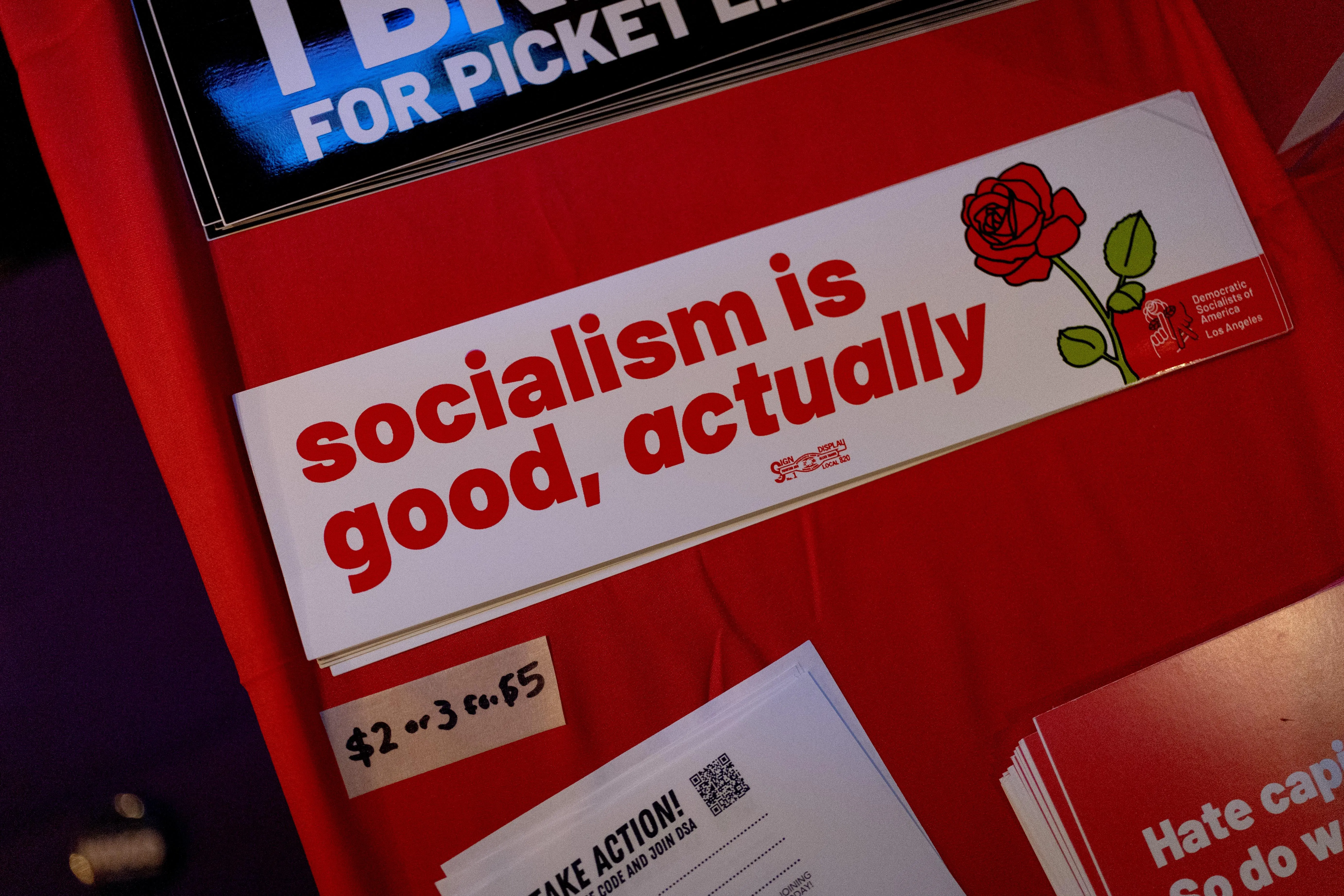 a bumper sticker that reads “socialism is good actually” a bumper sticker that reads “socialism is good actually”