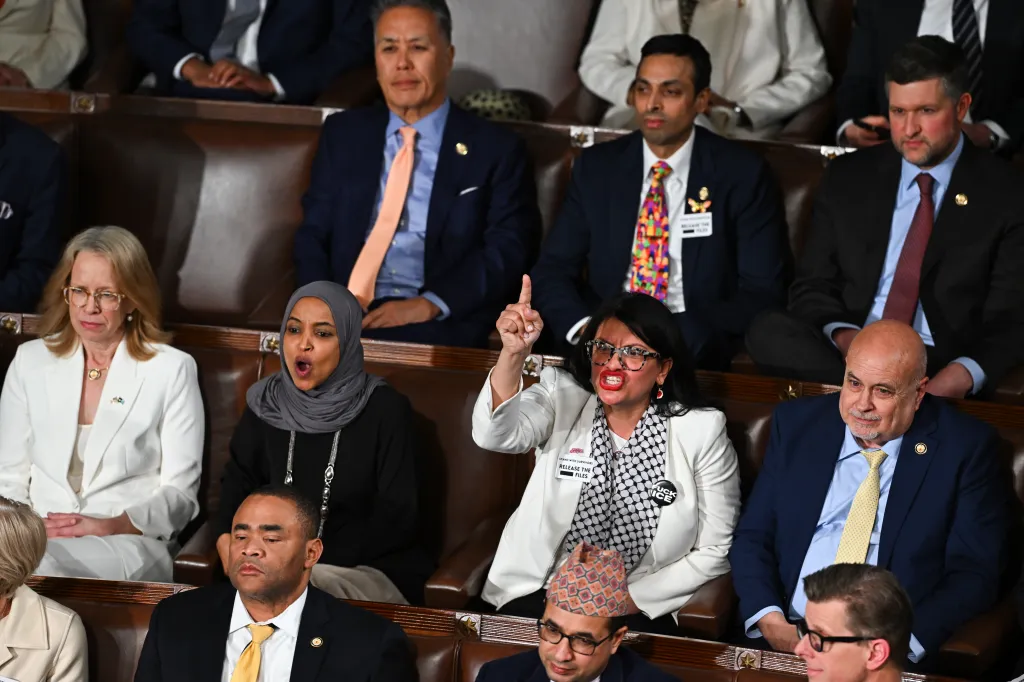 Reps. Ilhan Omar and Rashida Tlaib yell during President Donald Trump's State of the Union address at the Capitol on Feb. 24, 2026.