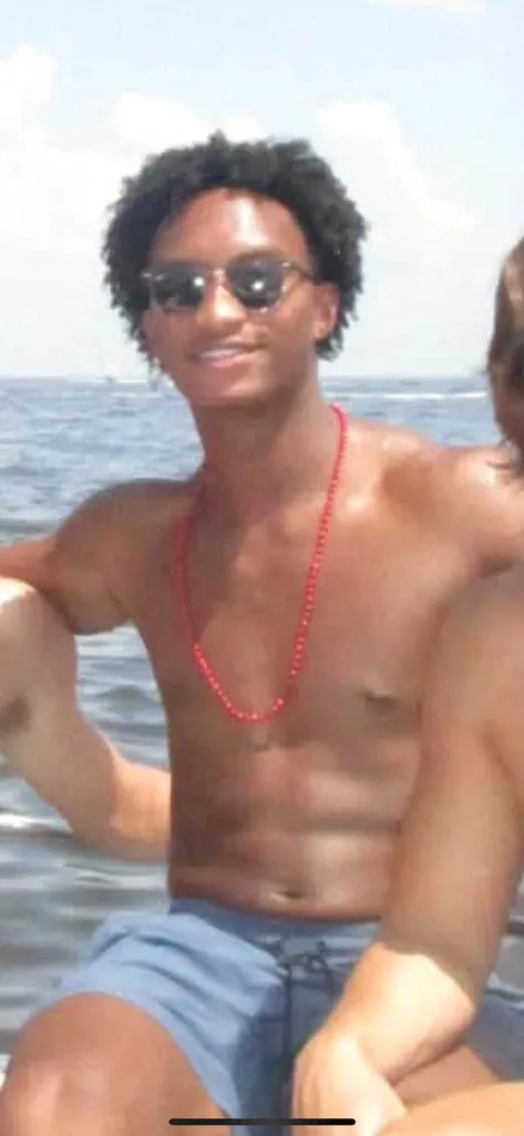 A photo of Nolan Xavier Wells smiling.