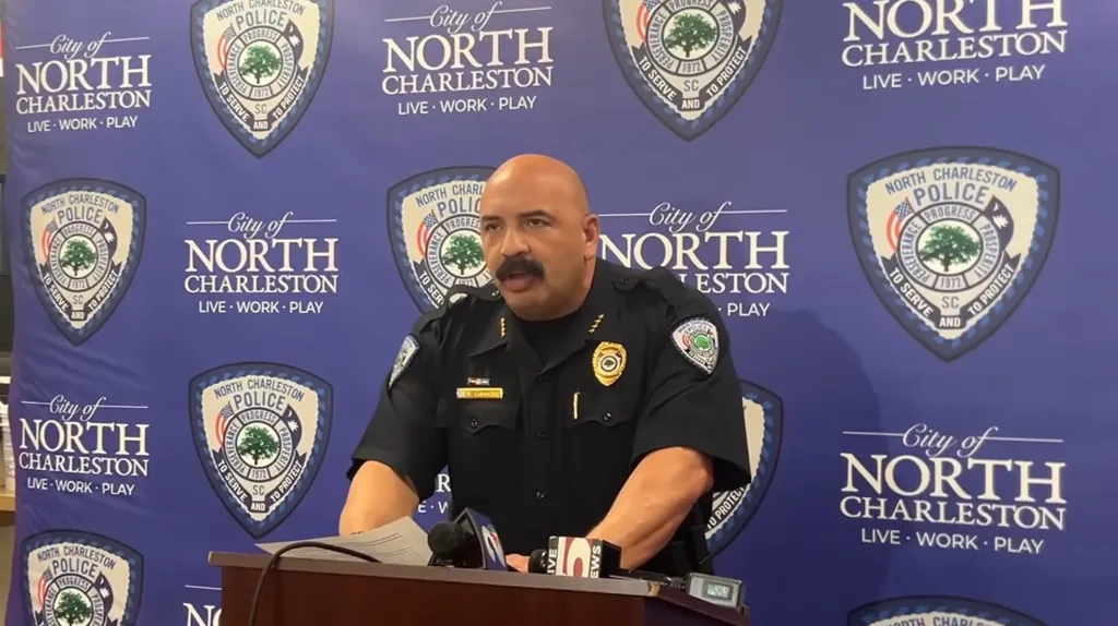 A North Charleston police officer speaks at a press conference.