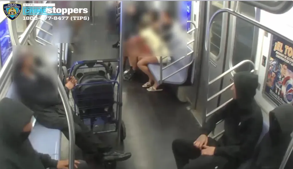 Surveillance footage showing people on a subway car.