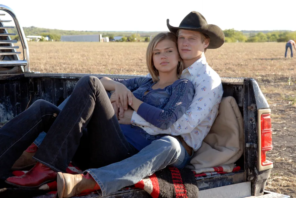Adrianne Palicki and Zach Roerig in a truck bed in "Friday Night Lights."