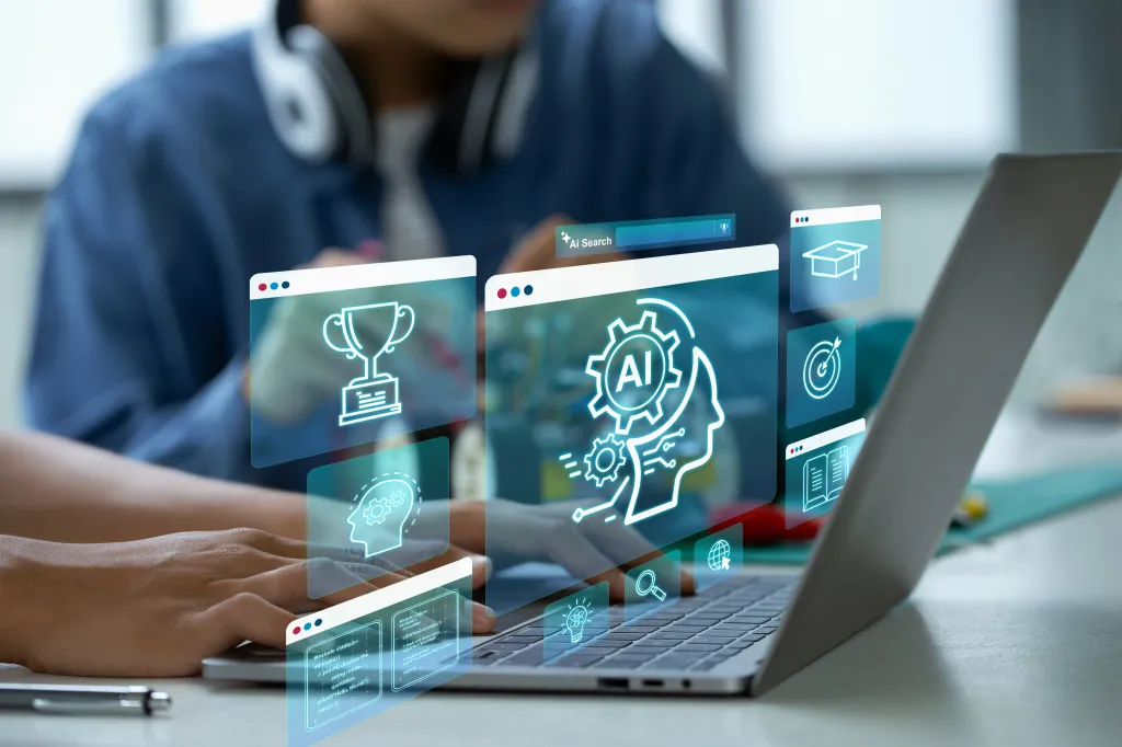 A person using a laptop with holographic screens displaying AI search, coding, a trophy, and other educational icons.