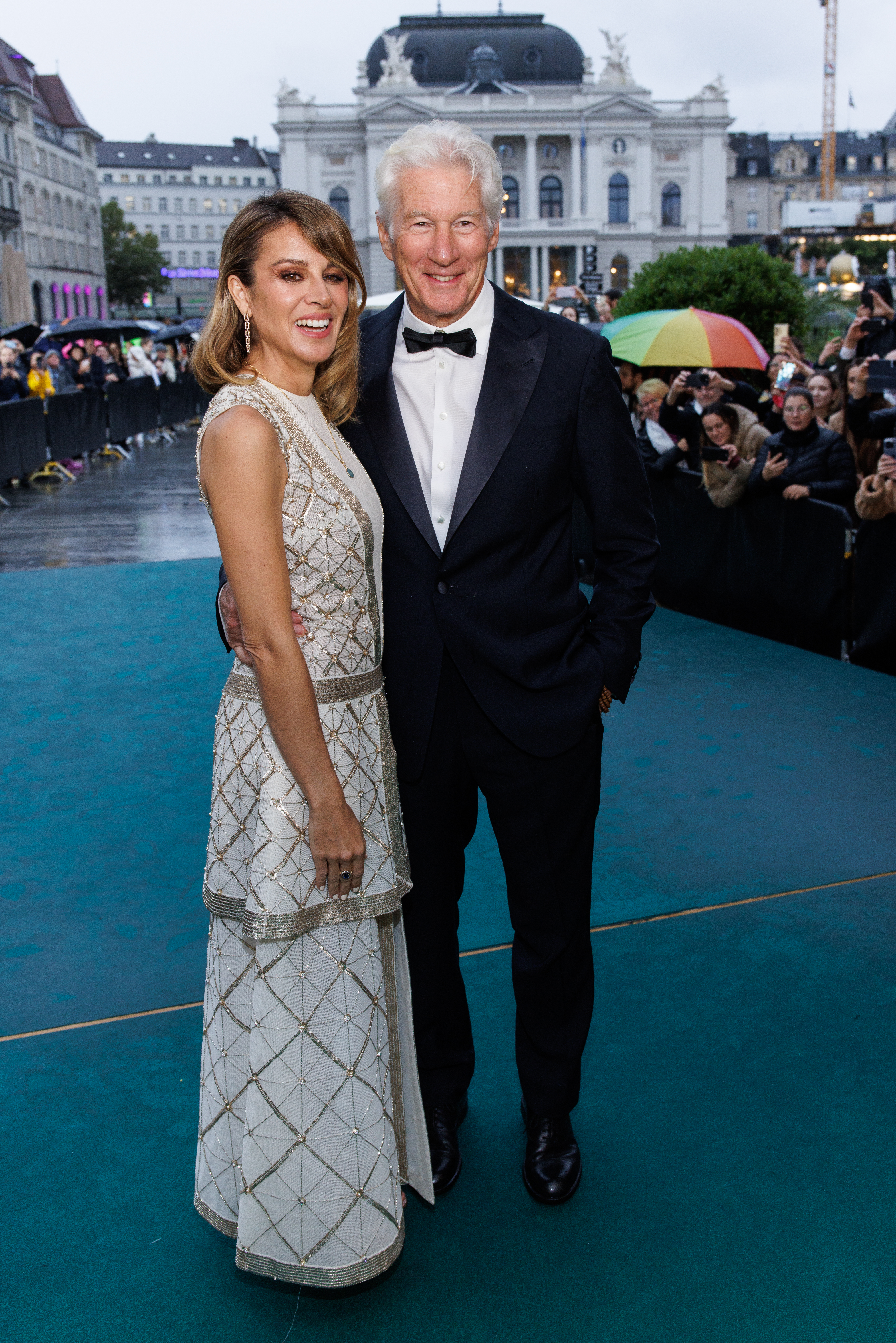 Alejandra Gere and Richard Gere attending the "Wisdom of Happiness" green carpet.