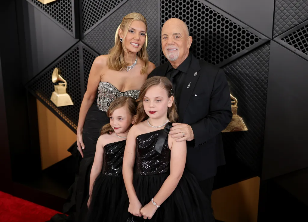 Alexis Roderick, Della Joel, Remy Joel, and Billy Joel on the red carpet.