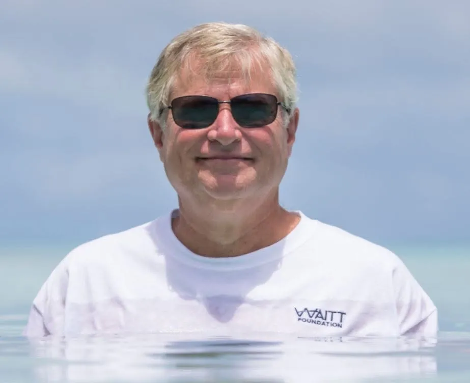 Kent Carpenter, an American marine biologist, wearing sunglasses and a white t-shirt.