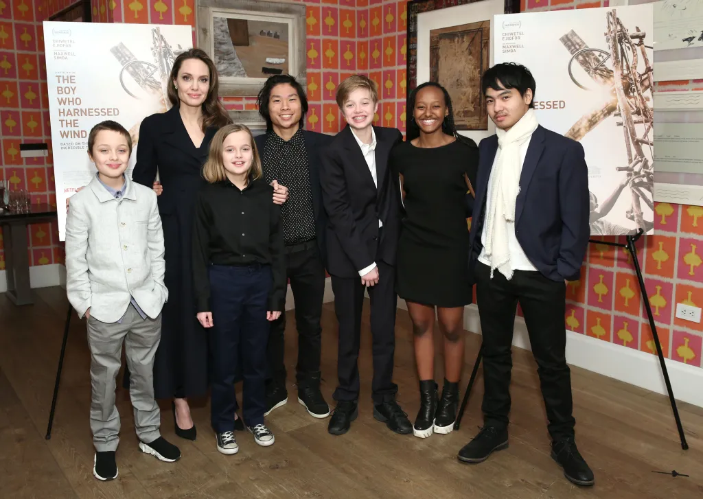 Angelina Jolie with her six children, Knox, Vivienne, Pax, Shiloh, Zahara, and Maddox, at "The Boy Who Harnessed The Wind" special screening.
