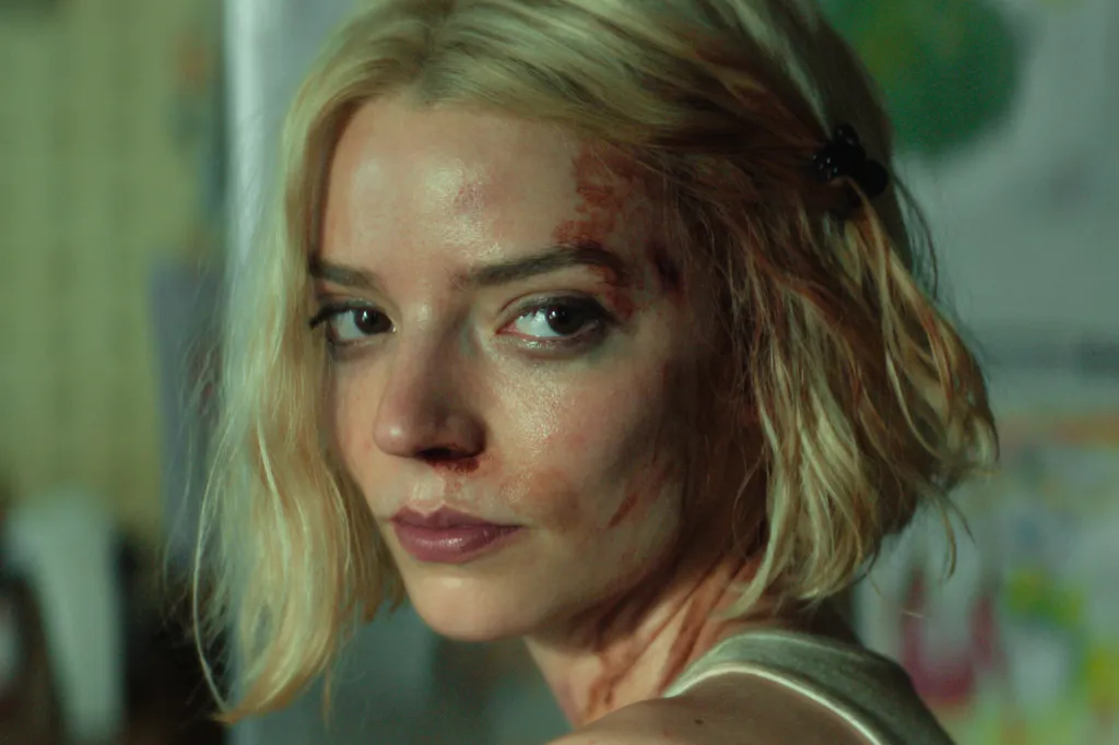 Anya Taylor-Joy with cuts and bruises on her face and neck.