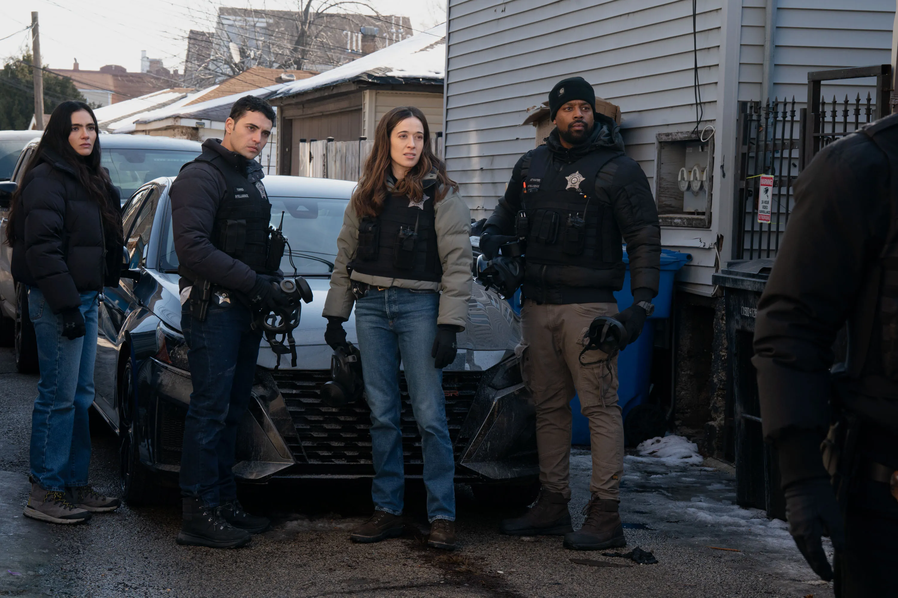 Arienne Mandi, Benjamin Levy Aguilar, Marina Squerciati, and LaRoyce Hawkins, from left to right, standing outside on a cold day.