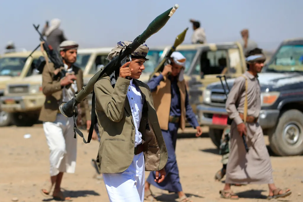 Armed Yemenis rally in solidarity with Lebanon and Iran.