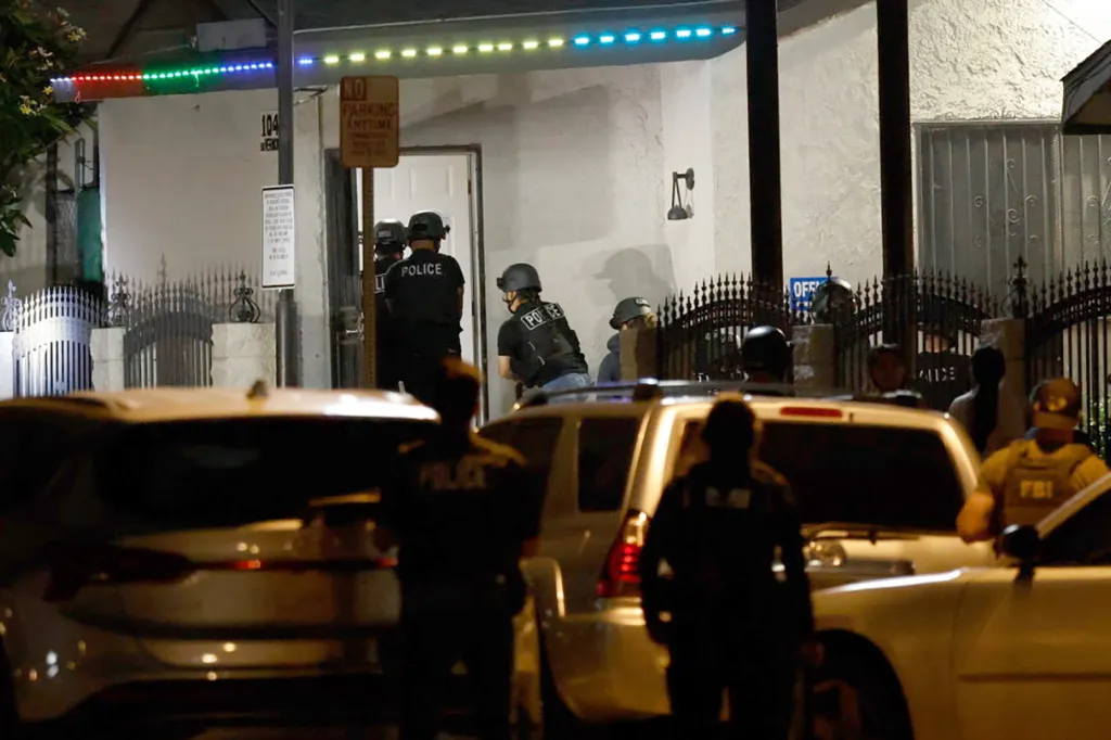 Police and FBI raid a motel in Figueroa Corridor.