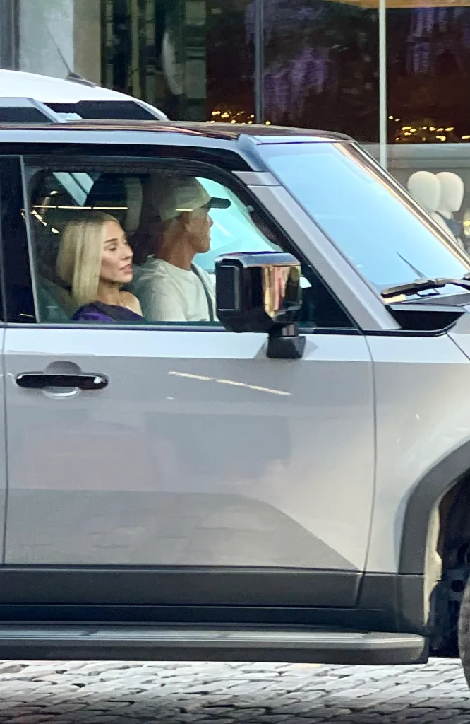 Ashley Avignone in a car with a man.