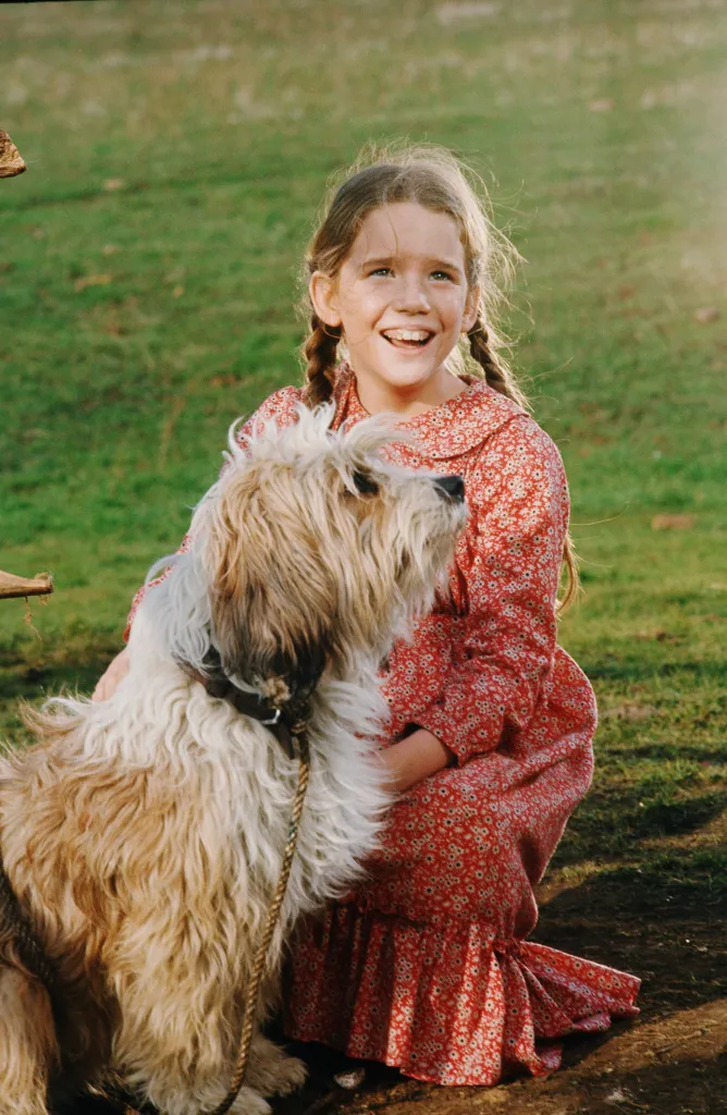 Melissa Gilbert as Laura Ingalls with her dog Jack from Little House on the Prairie.