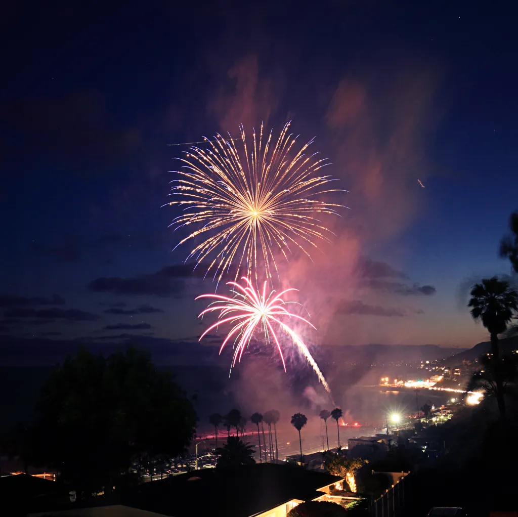 Fireworks blooming over Pacific Palisades, Los Angeles.