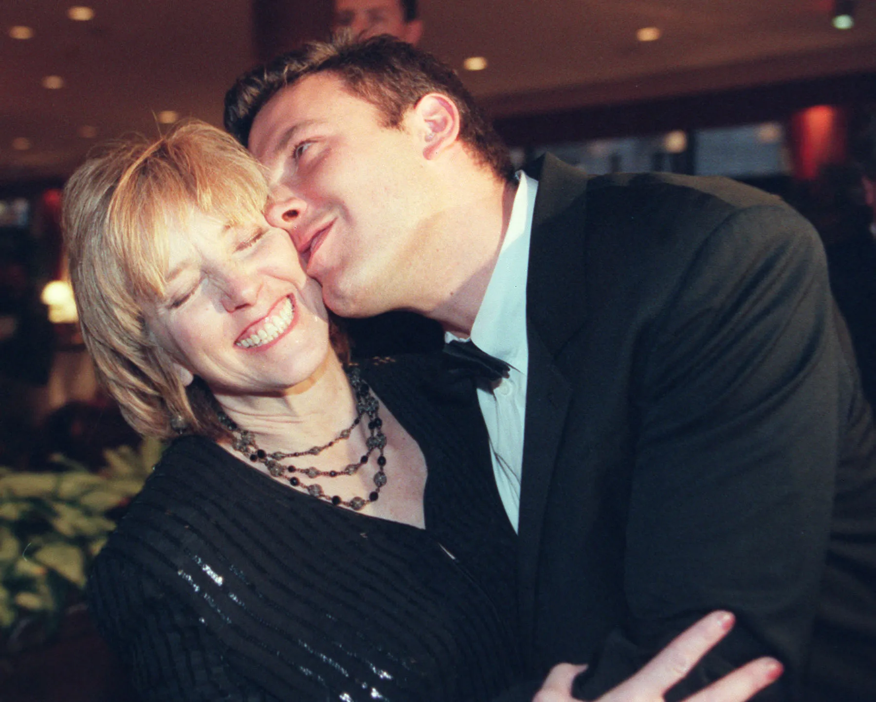 Ben Affleck kissing his mother Chris Affleck.