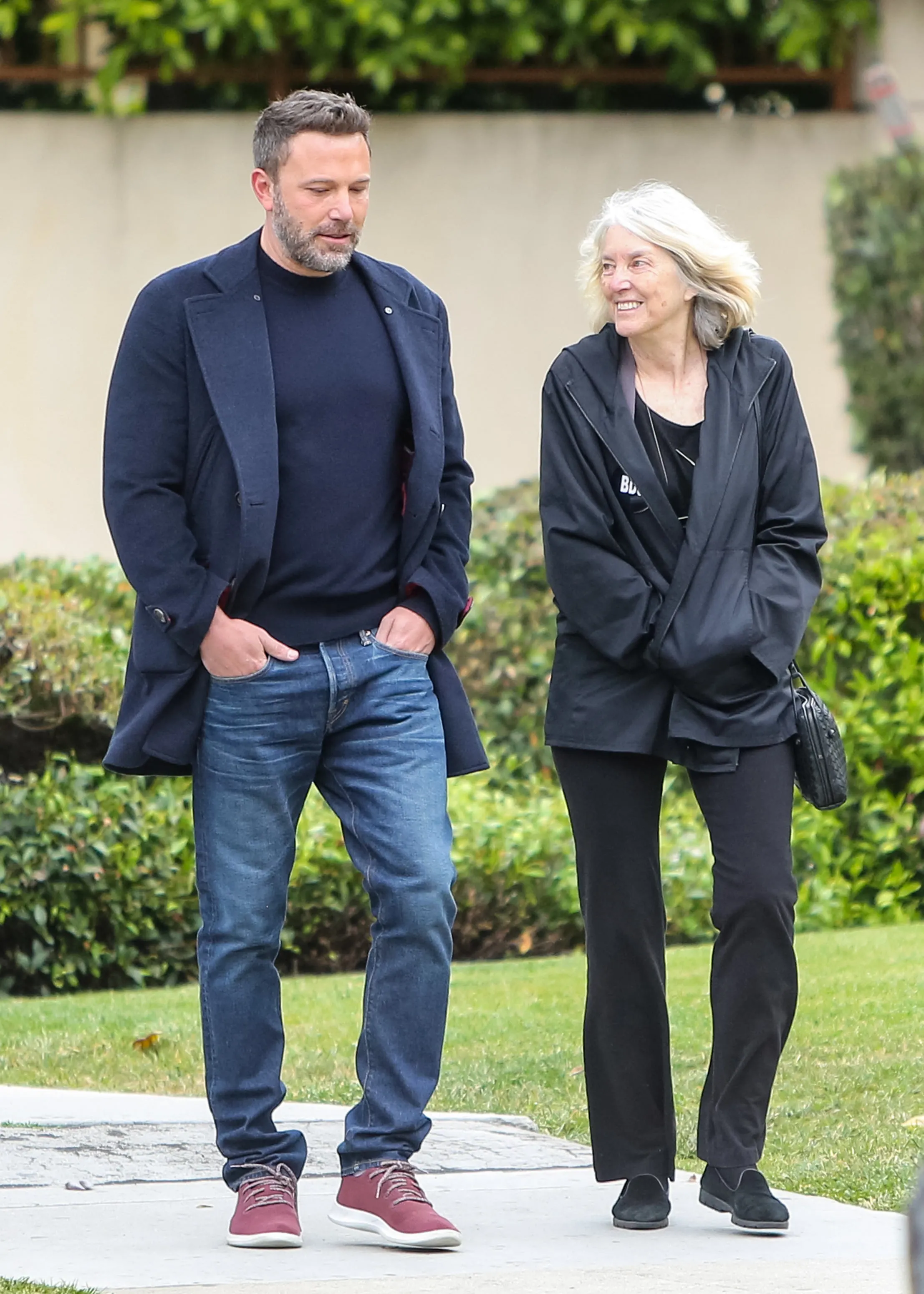 Ben Affleck and his mother, Christine Anne Boldt, walk together outdoors.