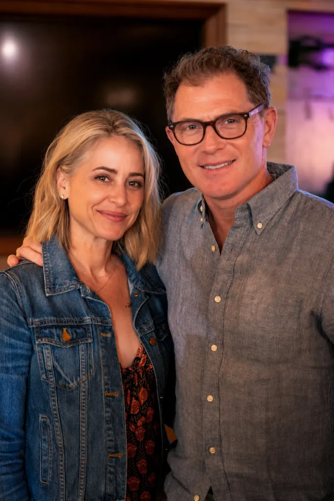 Bobby Flay and Brooke Williamson smiling.